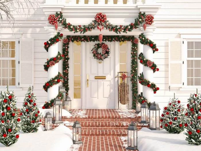 wreaths with red baubles and ribbons, hanging all around the front door, yard decorations, decorated trees on both sides