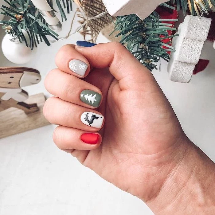 red white green grey and blue matte nail polish, short nails with different decorations on each nail, pretty nail colors