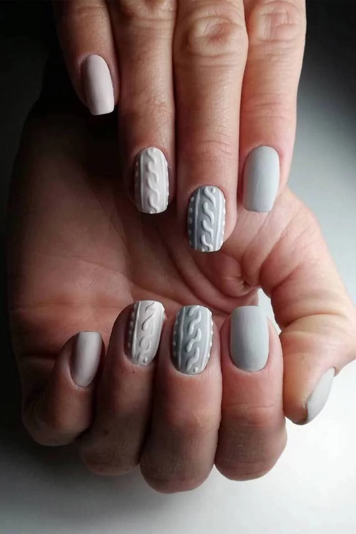 grey and white matte nail polish, winter nail designs, decorations on the middle and ring fingers