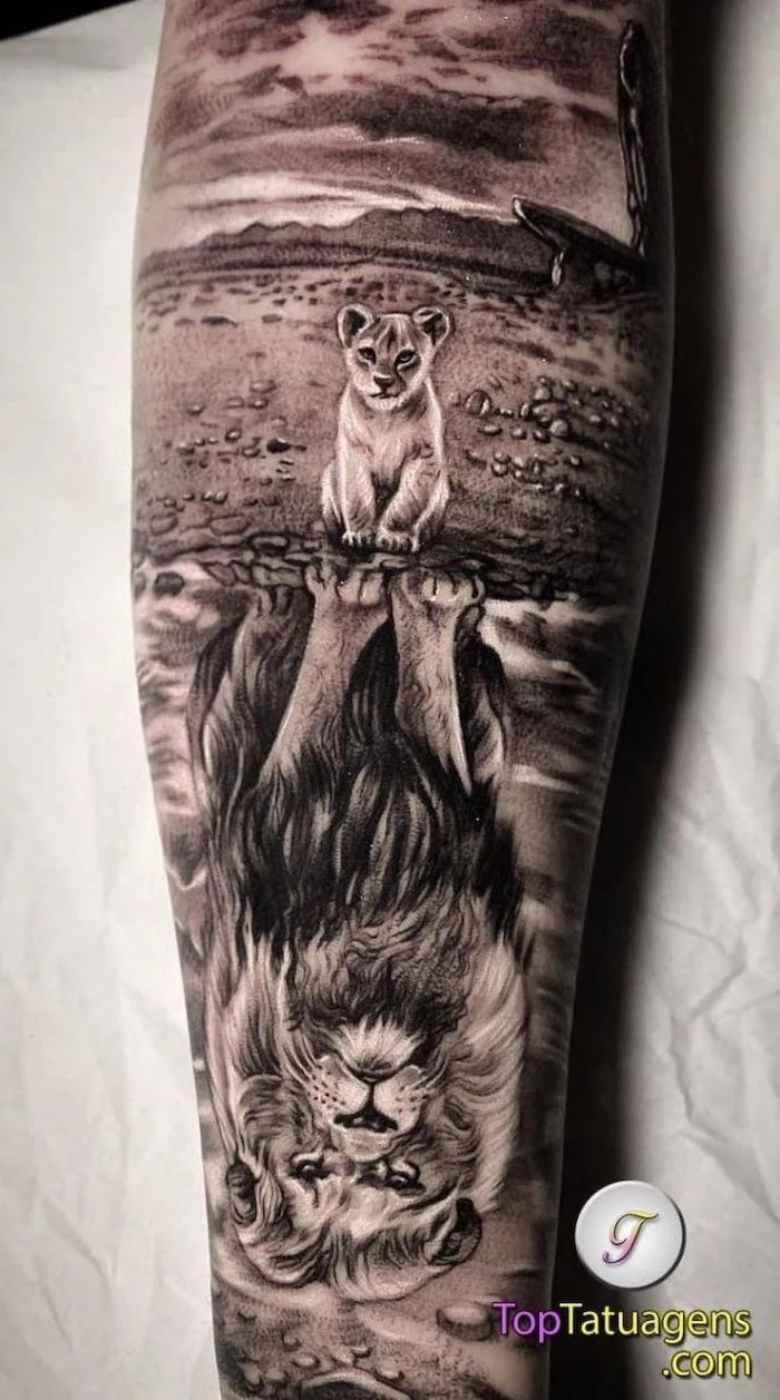 small lion cub, looking at its reflection in the water, large lion in the water, lion sleeve tattoo, back of leg tattoo