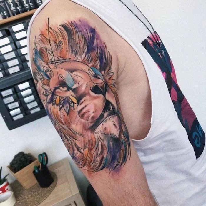 lion head with large mane, watercolor tattoo, lion tattoo on arm, shoulder tattoo in different colors