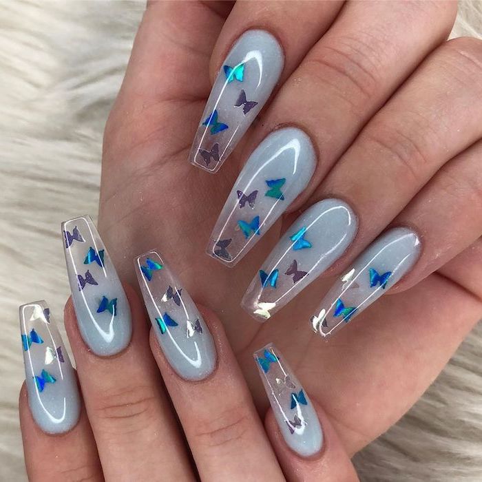 extra long coffin nails, blue to transparent acrylic nails color, nude ombre nails, butterflies decorations on each nail