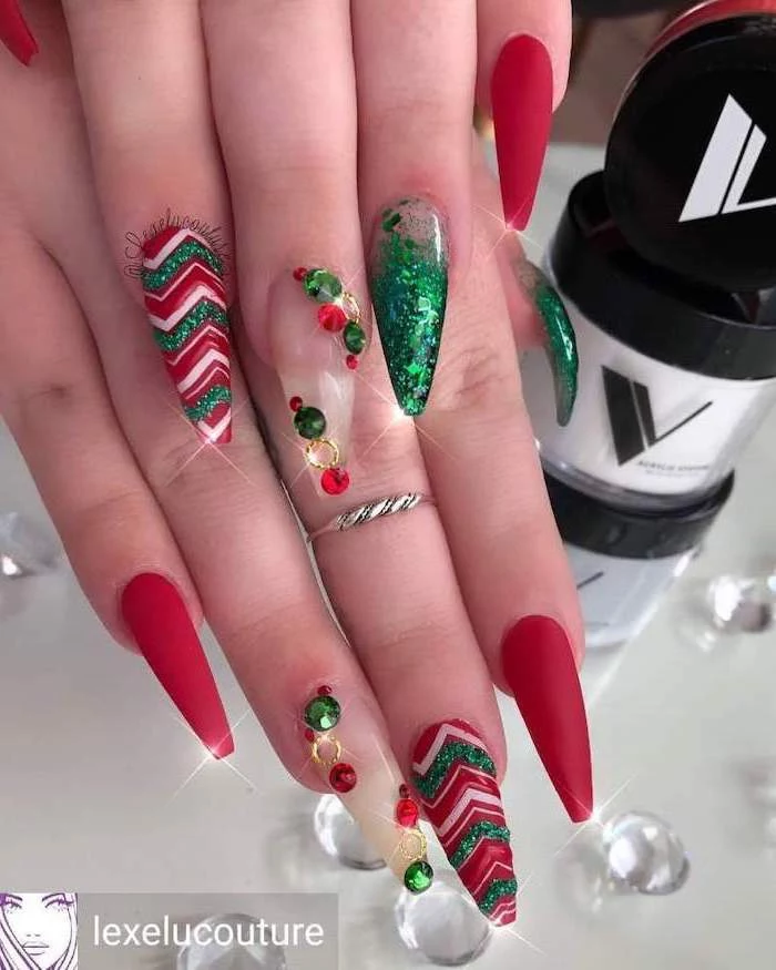 red matte nail polish, green glitter nail polish, winter nail designs, rhinestones and different decorations on each nail