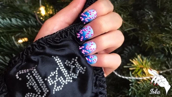 blue ombre nail polish, candy cane decorations on each nail, popular nail colors, medium length square nails