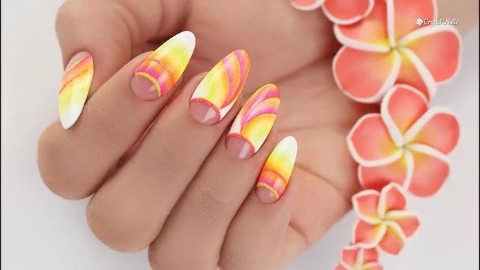 floral motif on long almond nails, blue ombre nails, pink to orange yellow and white gradient nail polish