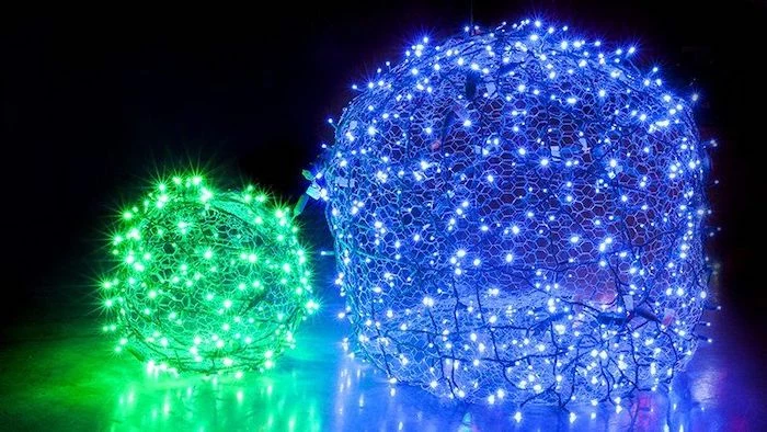 green and blue lights, intertwined in baubles, made of chicken wire, outdoor christmas decorations