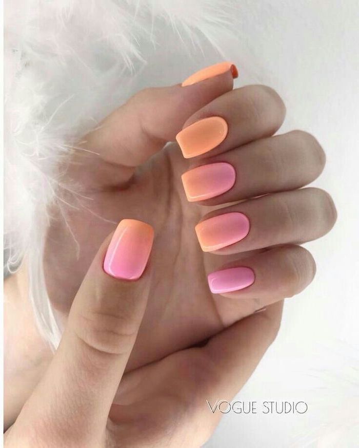 orange to pink gradient nail polish, french tip acrylic nails, short squoval nails, white feathers around it