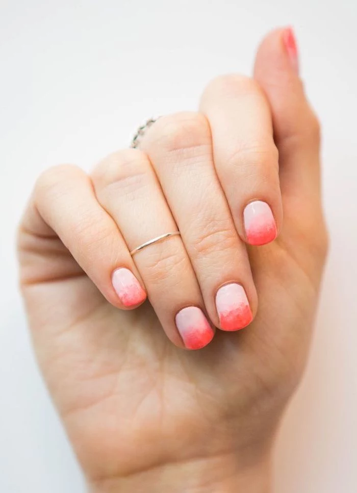 light to dark pink gradient nail polish, french fade nails, short squoval nails, white background
