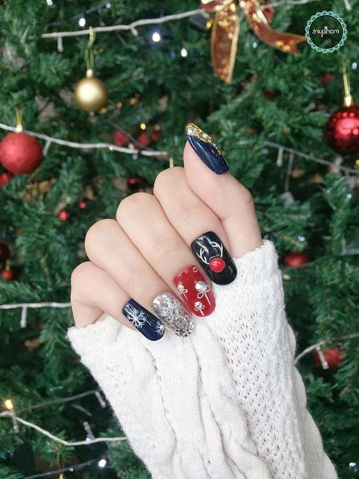 dark blue green and red nail polish, trending nail colors, silver glitter, different christmas themed rhinestone decorations