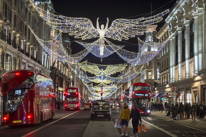 regent street london, benefits of shopping, regent street christmas decorations, people walking up and down the street