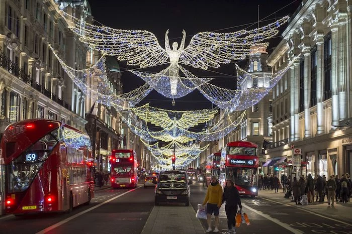 regent street london, benefits of shopping, regent street christmas decorations, people walking up and down the street