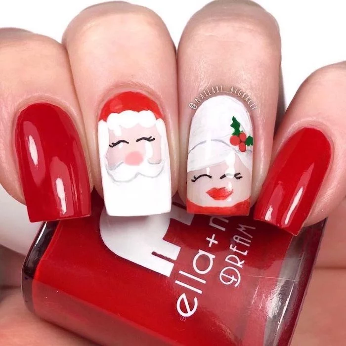 red and white nail polish, santa claus and mrs claus decorations on the middle and ring finger, christmas nail colors