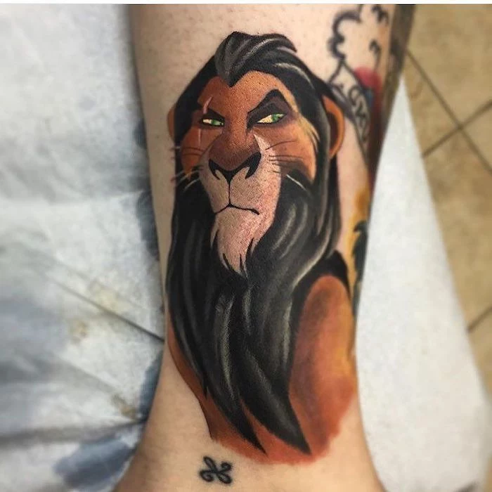 scar from lion king, disney character inspired, colored tattoo, lion tattoos for females, ankle tattoo