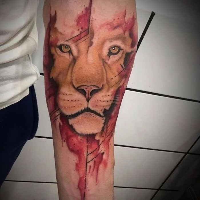 lioness head with red background, small lion tattoo, watercolor tattoo, forearm tattoo