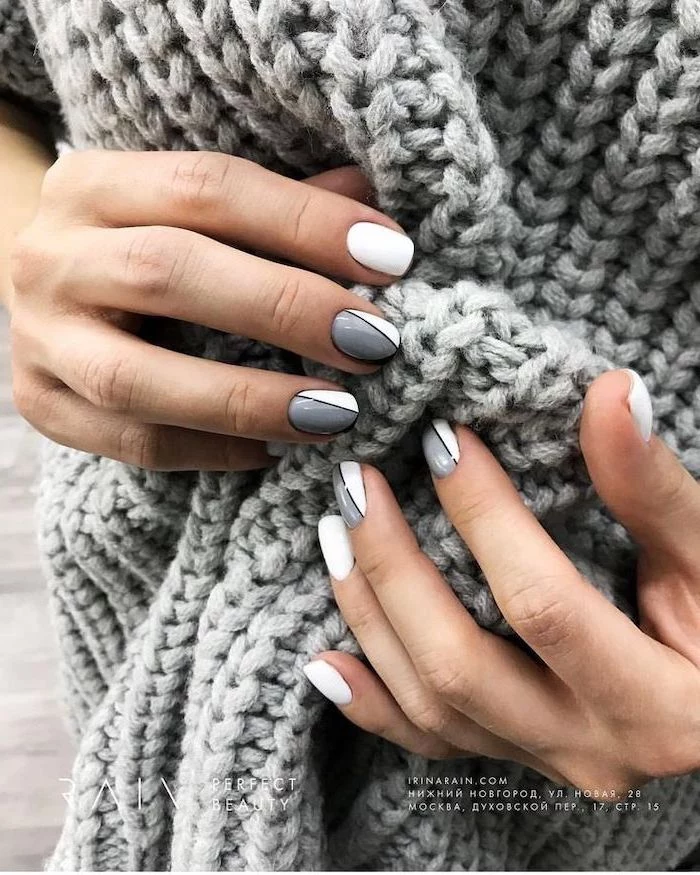grey and white nail polish, geometric decorations on each finger, cute winter nails, short squoval nails