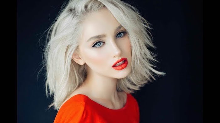 woman wearing red dress, red lipstick, hair color for short hair, shoulder length wavy blonde bob