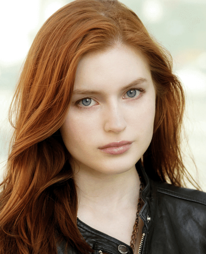 woman with natural auburn hair, wearing black leather jacket, hair color for short hair, long wavy hair