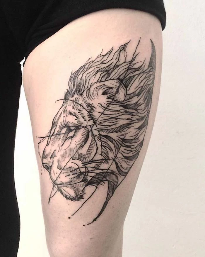 profile of a lion head with large mane, small lion tattoo, thigh tattoo on woman wearing black sweatpants