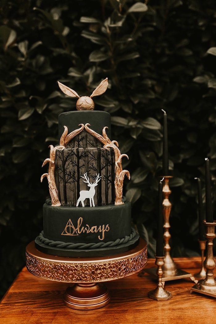 three tier cake, covered with dark green fondant, golden snitch on top, harry potter cake ideas, stag patronus on the middle tier