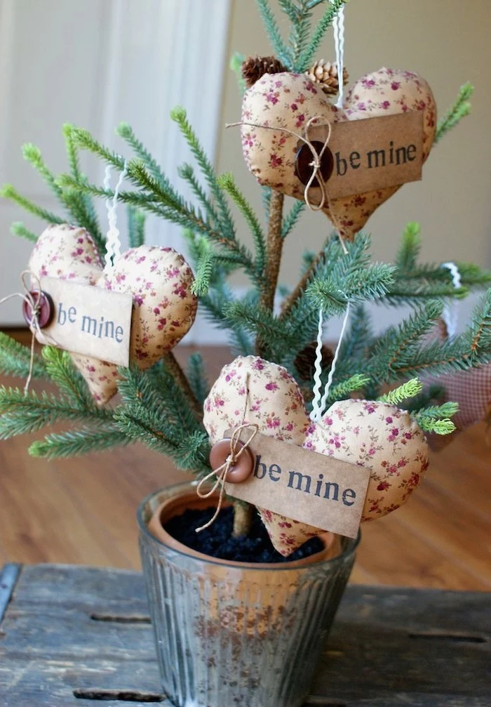 fabric hearts with wooden be mine signs, valentine decorations ideas, hanging on tree branch, planted in a metal pot