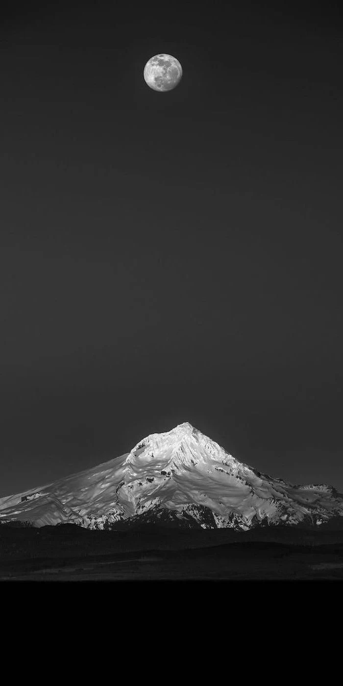 aesthetic wallpaper, black and white photo of a snowy mountain, full moon in a black sky, mountain landscape
