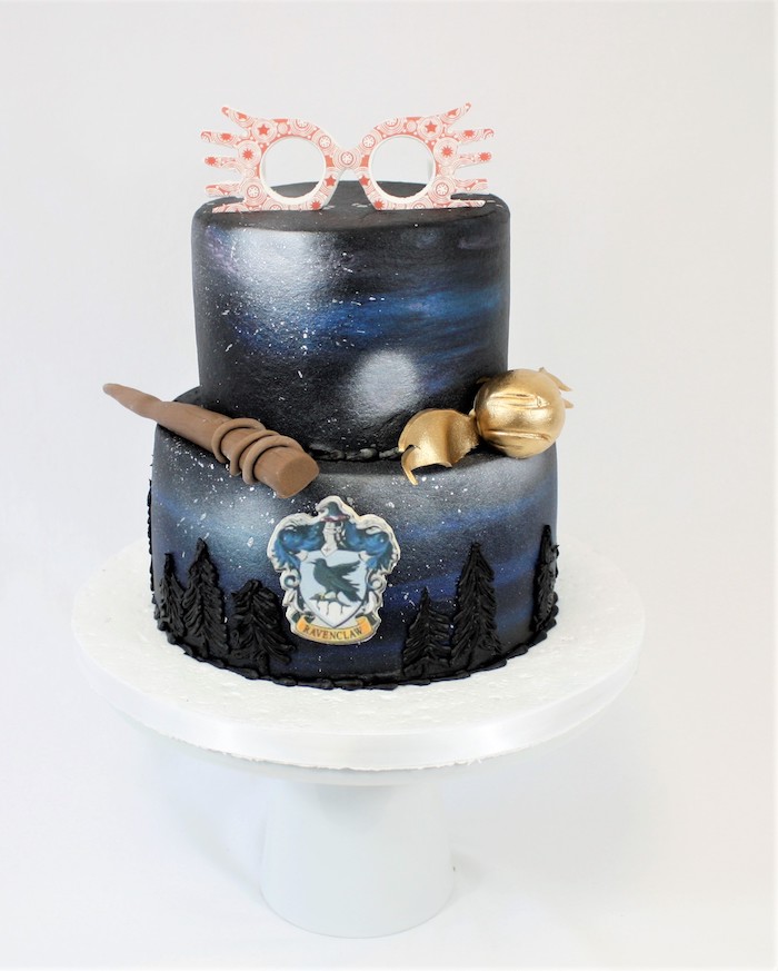 two tier ravenclaw cake, happee birthdae harry, painted in black and blue, luna lovegood's glasses topper