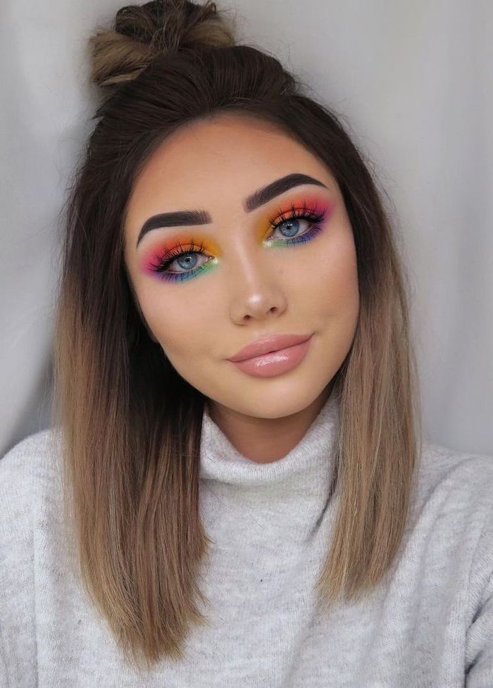 how to apply eyeshadow, woman with medium length hair, rainbow eyeshadow colors, nude lipstick, thick dark eyebrows