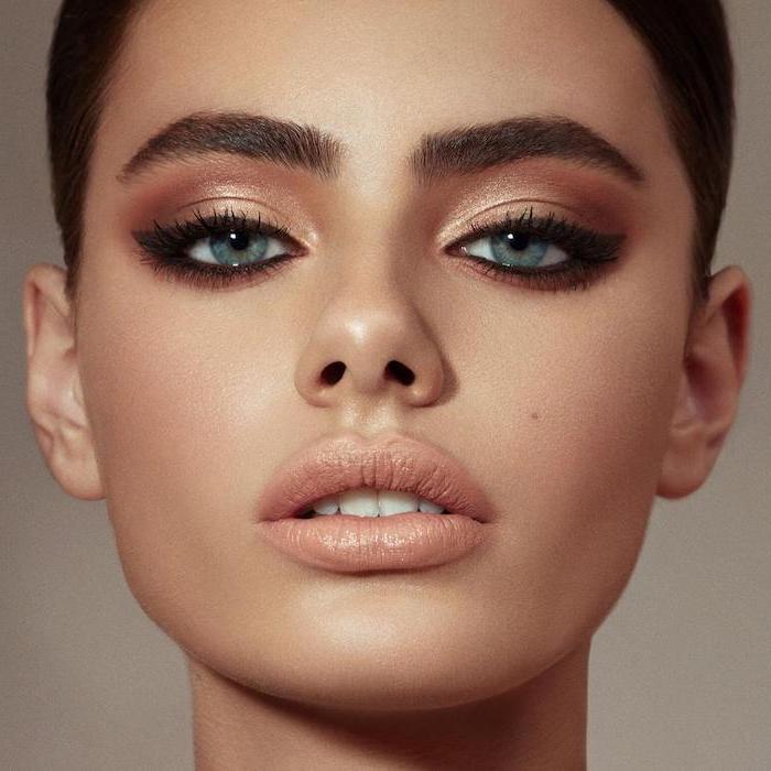 woman with blue eyes, eyeshadow looks, nude golden eyeshadow colors, nude lipsticks, black cat eyeliner