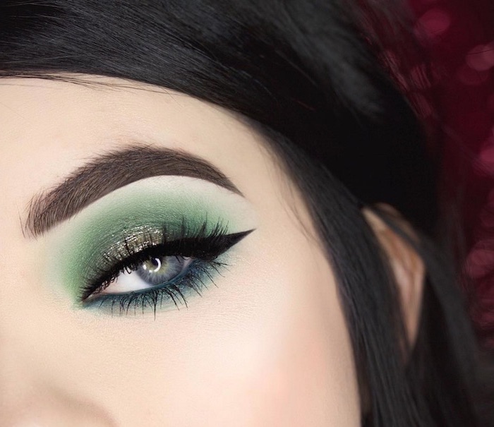 eyeshadow tutorial, woman with black hair and blue eyes, green and turquoise eyeshadow colors, black cat eyeliner