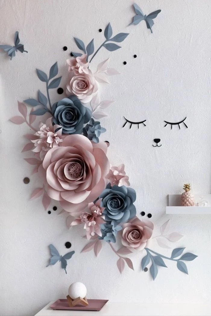 blush and dark grey paper flowers, arranged on a white wall, paper flower templates, different shapes and sizes