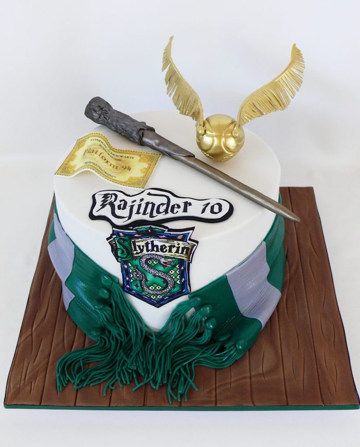 slytherin one tier cake, happy birthday harry cake, covered with white fondant, green and silver slytherin scarf, made of fondant