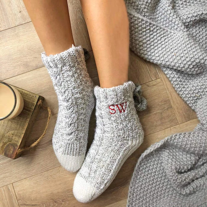 grey knitted cozy socks, personalised with initials, good valentines day gifts for her, wooden floor, grey knitted blanket