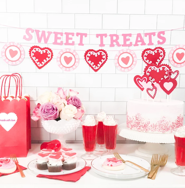 sweet treats banner, hearts garlands, hanging over desserts table, valentines day decor, cake cupcakes and milkshakes on top