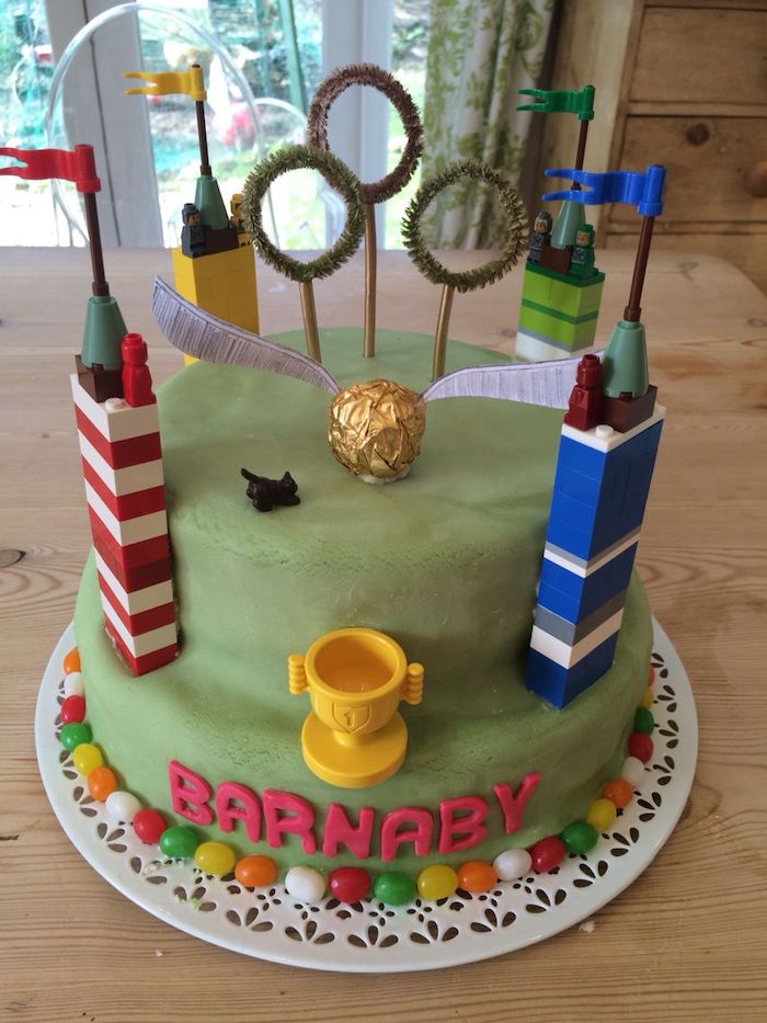 hagrid birthday cake, cake inspired by quidditch, covered with green fondant, placed on wooden surface