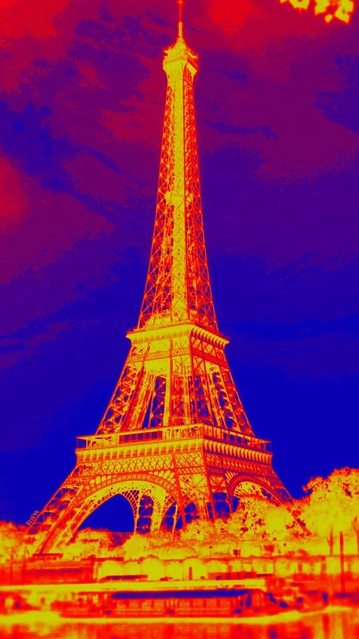photograph of the eiffel tower in negative, photo with a filter, cute aesthetic wallpapers, yellow orange and blue colors