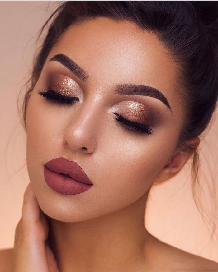 brunette woman with thick dark eyebrows, golden brown eyeshadow colors, dark burgundy red matte lipstick, eyeshadow ideas