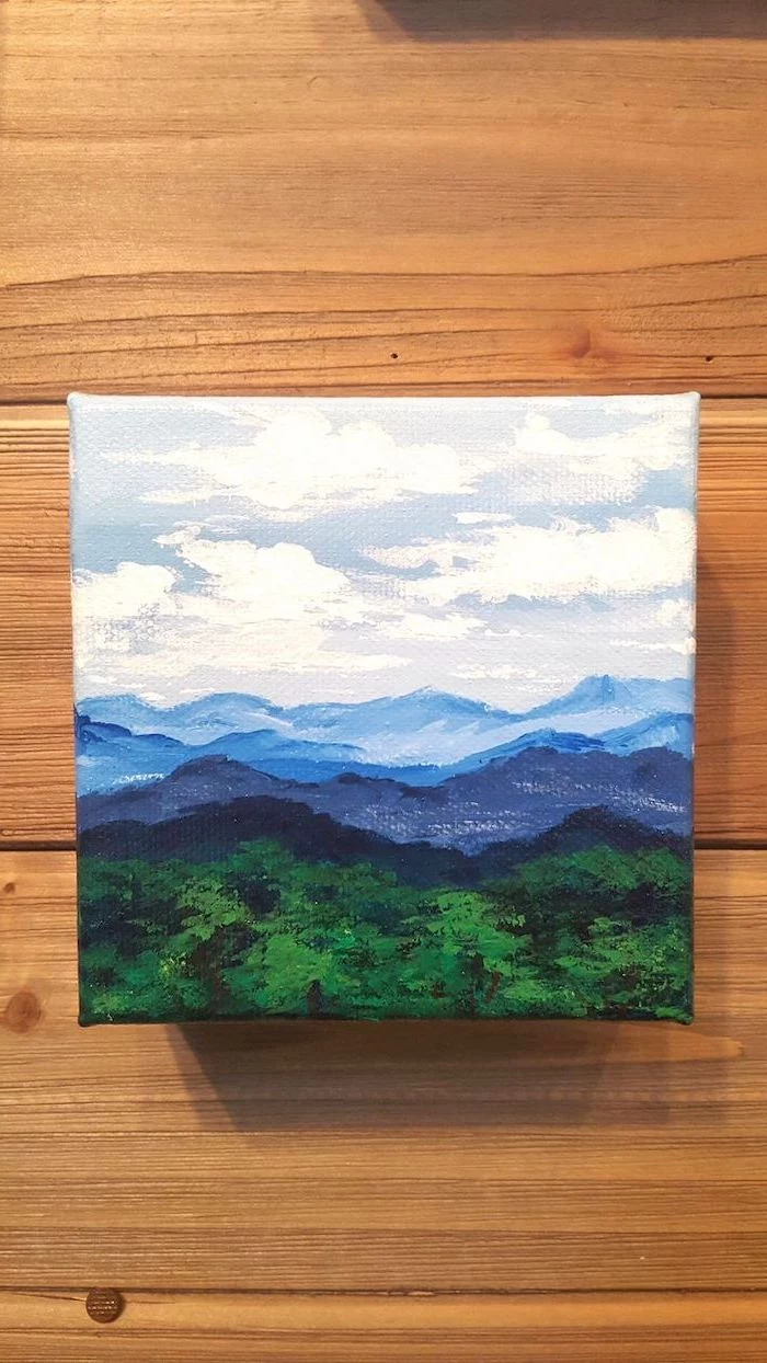 mountain and forest landscape, easy canvas painting ideas, white sky with clouds, over tall mountains and forests