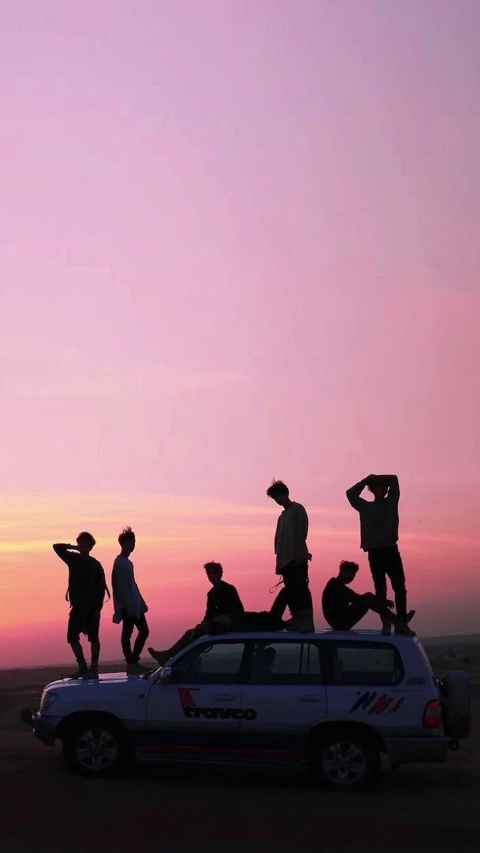 group of friends, standing or sitting on top of a jeep, parked on a road, cute aesthetic backgrounds, sunset purple sky, aesthetic phone backgrounds