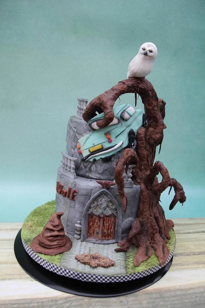 whomping willow, ron's flying car, made of fondant, harry potters birthday cake, two tier cake, placed on wooden surface