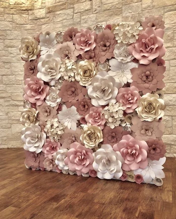 backdrop made with blush white and gold paper flowers, different shapes and sizes, paper flower wall decor, wooden floor