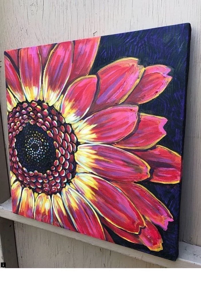 large flower with pink and yellow blooms, easy acrylic painting ideas, dark blue and purple background