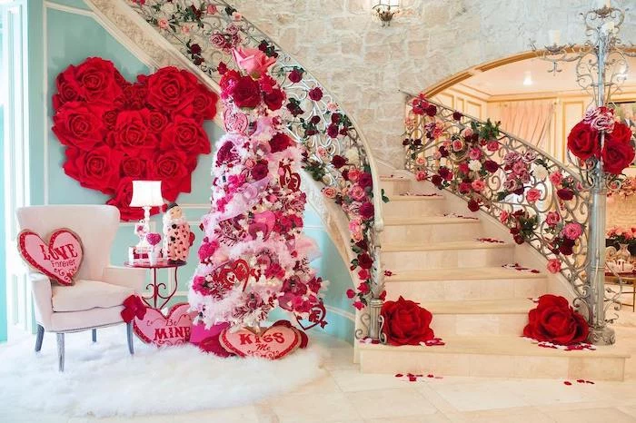 large staircase decorated with flowers, tree decorated with hearts and flowers, diy valentine decorations, pink heart shaped throw pillows