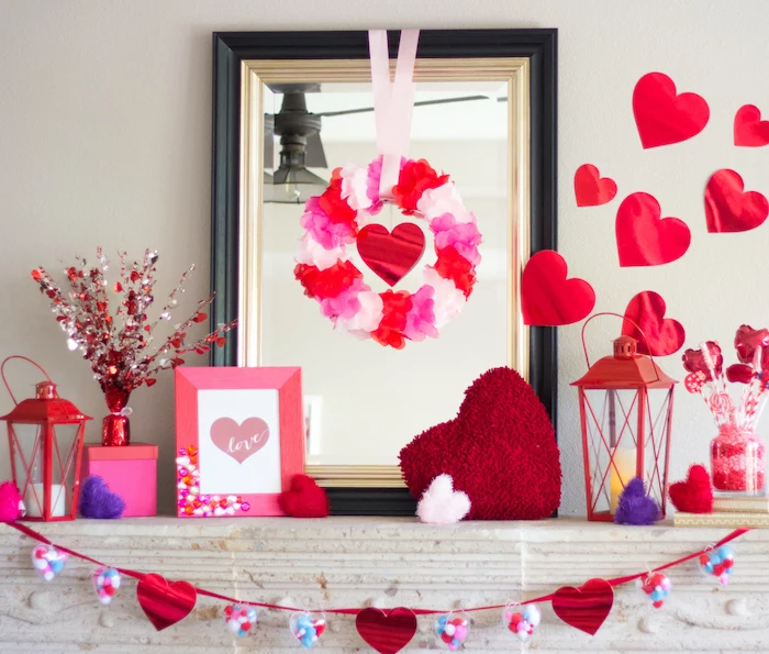 pink and red decorations, arranged over white mantel, valentine lights, hearts and wreaths, hearts garland and photo frame