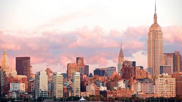new york city skyline, red aesthetic wallpaper, purple clouds in the sky, empire state building, chrysler building