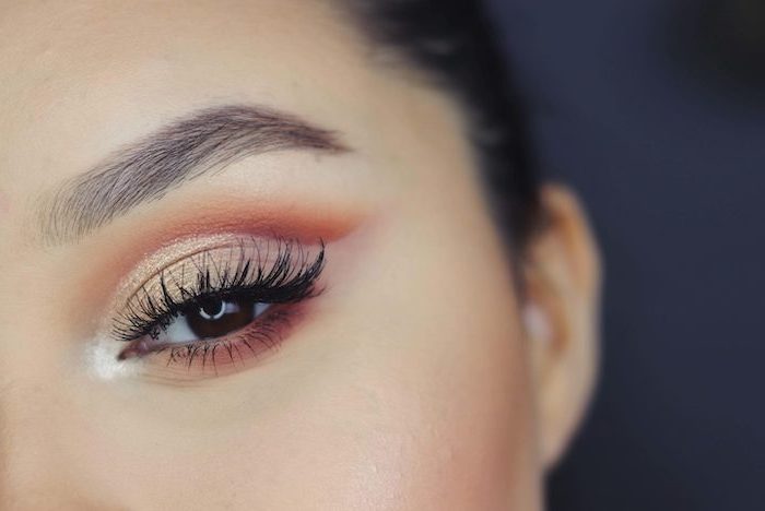 nude and orange eyeshadow colors, on woman with brown eyes, long black eyelashes, how to do makeup