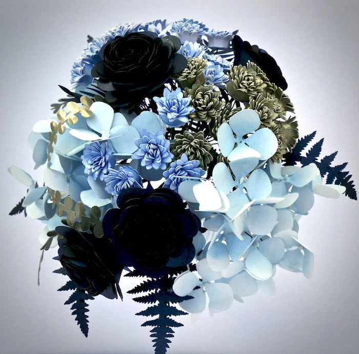 paper flowers in different shades of blue and gold, arranged in a bouquet, how to make flowers out of tissue paper