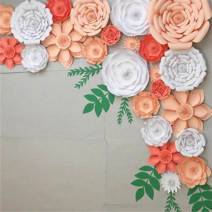 white and blush paper flowers, different shapes and sizes, how to make flowers out of tissue paper, arranged on grey wall