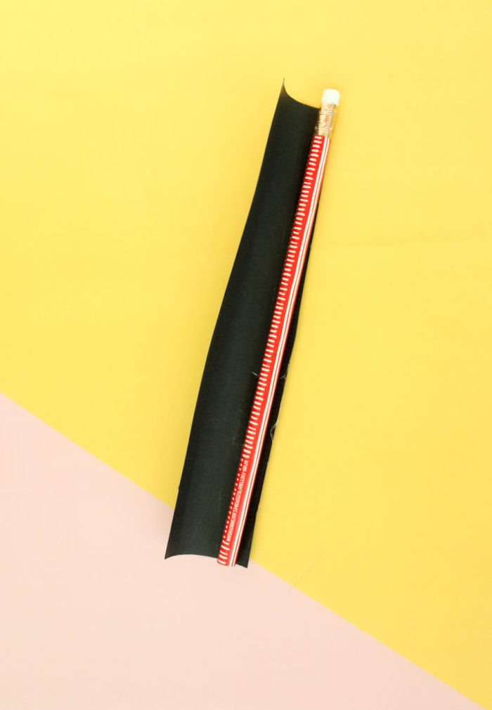 pencil covered with black tape, valentines day gifts for her, step by step diy tutorial, placed on a blush and yellow surface