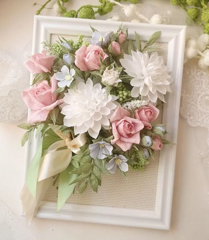 diy tissue paper flowers, white wooden frame, paper flowers arranged inside, placed on white surface