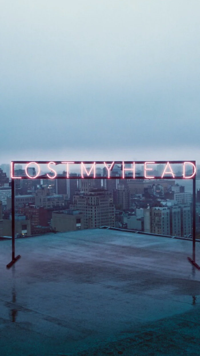lost my head neon sign, placed on top of a building, dark aesthetic wallpaper, city skyline in the background, aesthetic wallpapers for phone